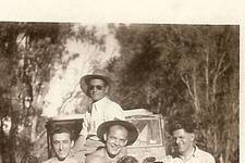 Left to right. Young boy (unknown),George Creatha (Kritharis) <i>O Katharos</i>, Theo <i>Belos</i> Coroneos, young man sitting on top of truck, (unknown), young girl (unknown),& Minas Kalokerinos from the <i>Monterey Cafe</i>.   

Theothosios Koroneos - <b>Theo Corones</b> - was sponsored to...