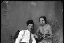 Panayotis Fatseas: Studio portrait of Dimitrios Veneris and Olymbia Fatseas, 10 June 1928. An unusually playful double portrait. Dimitrios Veneris and his sister-in-law Olymbia Fatseas belonged to the island’s more affluent social strata. Digital positive image from original glass negative....