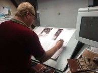 KWHF's Australian printer checking the print run sheets for Aphrodite and the Mixed Grill 