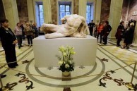 Visitors looking at the sculpture of the river god Ilissos, one of the Parthenon Marbles, at the State Hermitage Museum in Saint Petersburg on December 5. 
