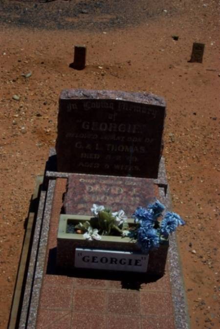 Ollie Konstandinou (Tzortzo)Poulos. Her gravesite in relationship to "Georgie" Thomas's. 