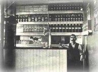 Woodburn, NSW - Kytherian store owner at counter of his store, circa 1922/23. 