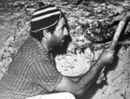 Archie Kalokerinos digging out opals. 