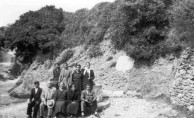 Uncle Theodore D. Gavrilys with hat sitting with relatives 