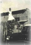 Bega - 1950's -  Greek cafe owner preparing wood for use in the kitchen. 