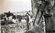 Workmen repairing the wall at Papoo's house 