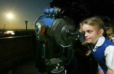 Venus - the PLANET - seven-year-old Jodie McGowan, of Artarmon, (Australia, has her turn at the telescope at Sydney's Observatory Hill. - Venus Transit - Seven-year-old Jodie McGowan of Artarmon has her turn at the telescope at Sydney's Observatory Hill. Photo  Robert Pearce