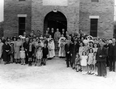 Congregation and priest outside St. Theodores Greek Orthodox Church in Townsville, 1947. - Congregation of St. Theodores Greek Orthodox Church in Townsville, 1947