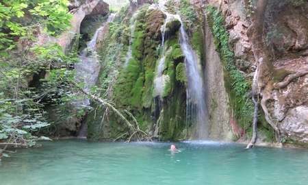 Kalami beach - Guardian Jemima swimming at the second waterfall down from Mylopotamos