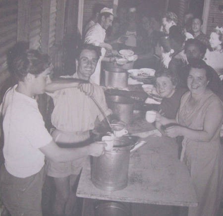 Migrants collecting their meals.... - Migrant Centre