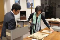 Bon Koizumi and wife Shoko Koizumi examining the exhibits in New Orleans 