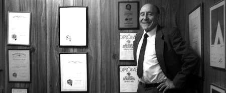 The International Exhibition of Inventions in Geneva in full swing - John Notaras in front of the medal wall at Atom Industries