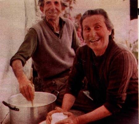 Mrs Metaxia Frilingos makes fresh mizithra cheese, assisted by Mr Andres Psaltis. 1976. 