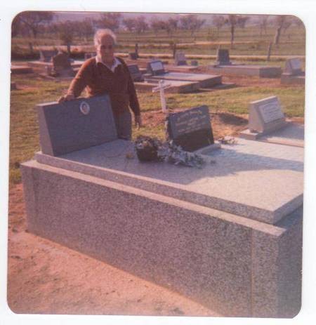 Theo Comino [Palavras] next to his wifes grave 