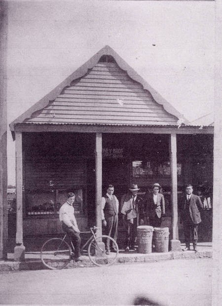 History of the Aroney Family in Nowra. - Group Picture Front of Greek Cafe