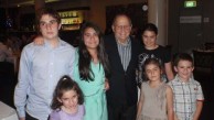 Angelo Notaras surrounded by his grandchildren 