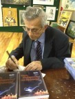 Jim Saltis signing copies at the launch of his latest book Ευχές αναθεματισμοί και εξορκισμοί 