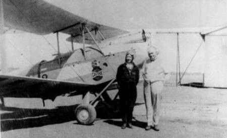 'Lores' Bonney and her aeroplane at Charleville airport, Queensland, 1933. 